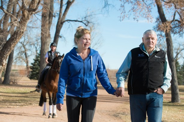 Leslie and John Malone walk at Harmony Sporthorses, December 2, 2014.